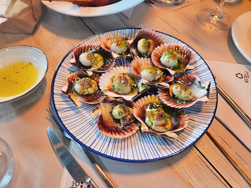 Delicious scallops served on a plate, garnished with herbs, in Santiago de Compostela.